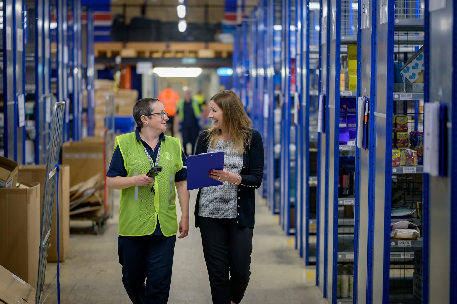 Warehouse supervisor coordinating a crew